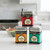 Three tins from the Spicewalla Taco Collection are stacked on a kitchen counter.