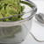 The RSVP Endurance Stainless Steel Mesh Basket filled with Artichokes