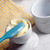 A RSVP International butter pot lid being filled with softened butter