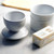 A RSVP International butter pot open with a stick of butter
