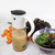 A RSVP International oil and salad dressing dispenser filled with salad dressing
