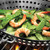 The Outset Nonstick BBQ Skillet cooking shrimp and snow peas