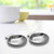 The set of 12 Outset grillable clam shells for stuffed shells on a kitchen counter
