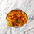 One of the Outset grillable clam shells with baked stuffed clams filling