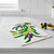 The Wet-It! Olive Branch Swedish Cloth on a kitchen counter with olives and a little bowl of olive oil