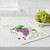 The Wet-It! Grapevine Swedish Cloth on a kitchen counter