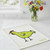 Wet-It! The Spotted Chicken Swedish Cloth on a kitchen counter with wildflowers in a vase