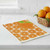A Wet-It! Orange Slices Swedish Cloth on a kitchen counter