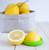 Food Huggers Citrus Savers with two lemon halves and more lemons
