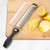 The PL8 Stainless Steel Zester Grater on a cutting board with lemons and lemon zest