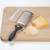 PL8 Fine Grater on cutting board with cheese