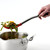 Grip-EZ Slotted Spoon Silicone and Stainless Steel In Use