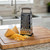The Norpro 4 sided box grater on a cutting board with cheese