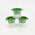 The three molds of the Tovolo Golf Ball Ice Molds Set are stacked.
