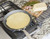 Nordic Ware Traditional Steel Crepe Pan in use on a stovetop