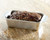 Nordic Ware Meatloaf Pan with Insert with a cooked meatloaf in it