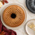 An overhead view of a baked Bavaria Bundt on a white serving plate.
