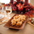 Cakes baked in the Nordic Ware Autumn Cakelet Pan on a plate on a holiday decorated table