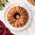 An overhead view of a cake baked in the Nordic Ware Original Bundt Pan with no icing.