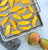 Nordic Ware Extra Large Oven Crisp Baking Tray with mango slices