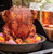 Nordic Ware Beer Can Chicken Roaster with chicken and veggies on a grill