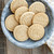 Cookies made with Nordic Ware Greetings Cookie Stamps in a bowl on a table