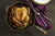 Overhead view of a FINEX 12-Inch Cast Iron Skillet with a roasted chicken in it on a table.