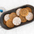 Cookies made with the Nordice Ware snowflake cookie stamps in a tray