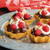 Sweet timbales made with the Nordic Ware Swedish Rosettes & Timbales Set filled with chocolate pudding whipped cream and raspberries