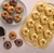 An overhead view of mini Bundt cakes baked in the Nordic Ware 75th Anniversary Braided Mini Bundt Pan on a table