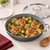 A GreenPan Paris Pro 11 Inch Everyday Pan with chicken thighs, potatoes, and green beans.