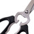 A closeup view of the nutcracker, jar lid opener/gripper, and bottle opener part of the scissors