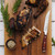 One of the Messermeister Avanta Pakkawood Steak Knives on a cutting board with chicken