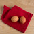 The Now Designs Ripple Red Cotton Dish Cloths on a kitchen counter with eggs