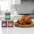 The Spicewalla Grill Lovers Collection stacked on a kitchen counter next to a spice rubbed whole roasted chicken
