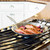 The Heritage Steel French Skillet cooking salmon on a stove top
