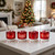 Ornament ice cubes made with the Tovolo Christmas Ornament Ice Molds in cocktails on a kitchen island.