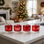 Ornament ice cubes made with the Tovolo Christmas Ornament Ice Molds in cocktails on a kitchen island.