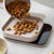 Almonds being poured into the weighing bowl on the Rosti Mensura Digital Kitchen Scale