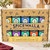 The 10 tins of the Spicewalla Signature Gift Set are in the gift set packaging on a kitchen counter.