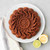 An overhead view of a cake baked in the Nordic Ware Citrus Twist Cake Pan on a platter