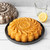 A cake baked in the Nordic Ware Citrus Twist Cake Pan with a lemon glaze
