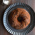 A cake made in the Nordic Ware Let It Snow Bundt Pan on a plate dusted with powdered sugar