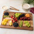 The Architec Acacia Wood Large Grazing Board with fruit