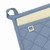 A closeup view of the hanging loop of the Now Designs Superior Slate Blue Pot Holder