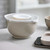 The Rosti Margrethe Mixing Bowl splash guard lid with the center in place and on a mixing bowl