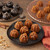 Mini cakes made in the Nordic Ware Lil pumpkins Cakelets pan on a plate and the pan upside down on a table