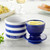 The Nautical Stripe Butter Bell Crock with its lid off and filled with butter