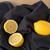 The Now Designs Ripple Black Dish Towel with lemons