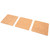 The Fox Run Square Cork Trivets Set in a diagonal layout